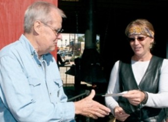 Sue Murray, Balcones Force Blacksmith presents check to Dave Phillips, President of Rockdale Historical Society 